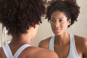 Woman Looking in Mirror
